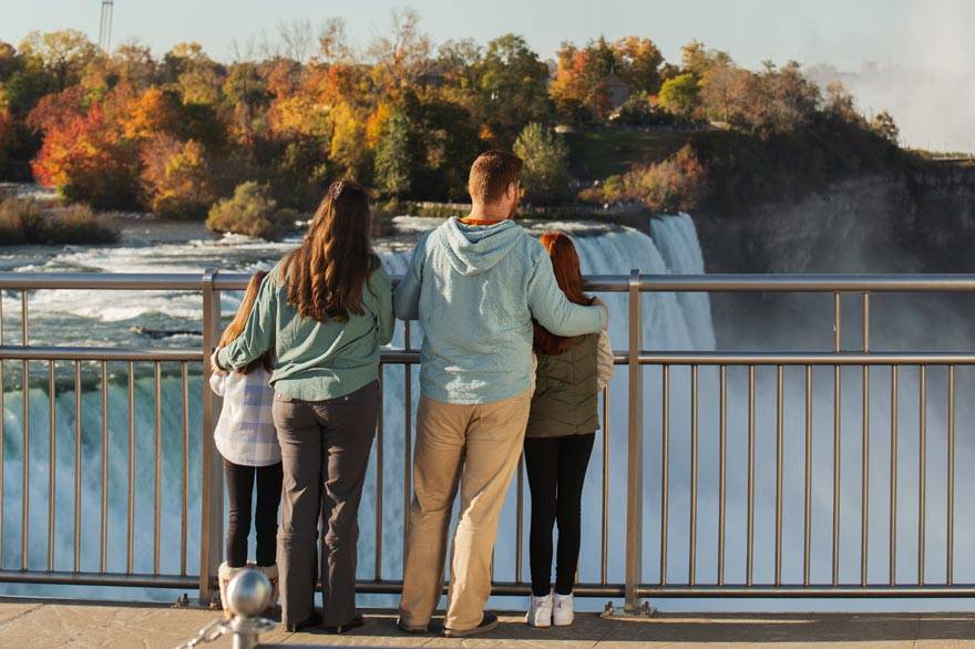 A family taking in the view from the top of Niagara Falls