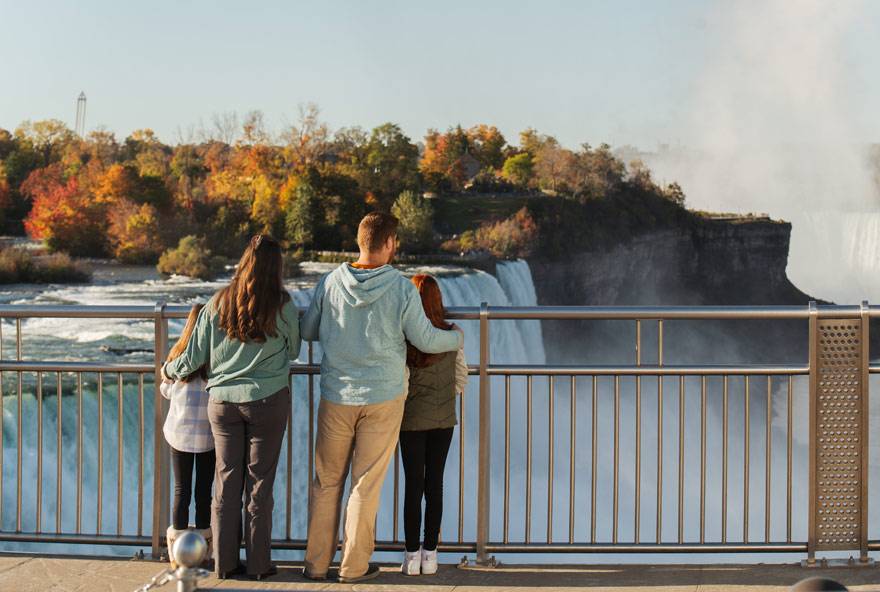 A family looking at Niagara Falls